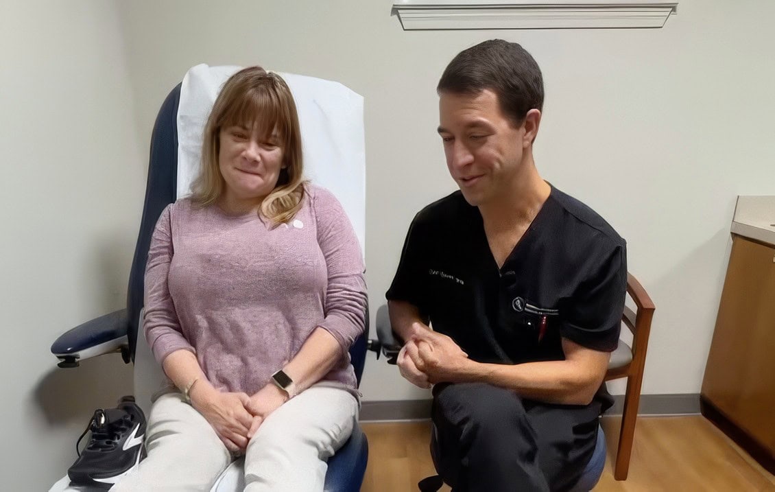 Patient consultation with Dr. Speer at Emerald Coast Foot and Ankle Center, showcasing a positive interaction about InvisiFoot™ procedure outcomes.