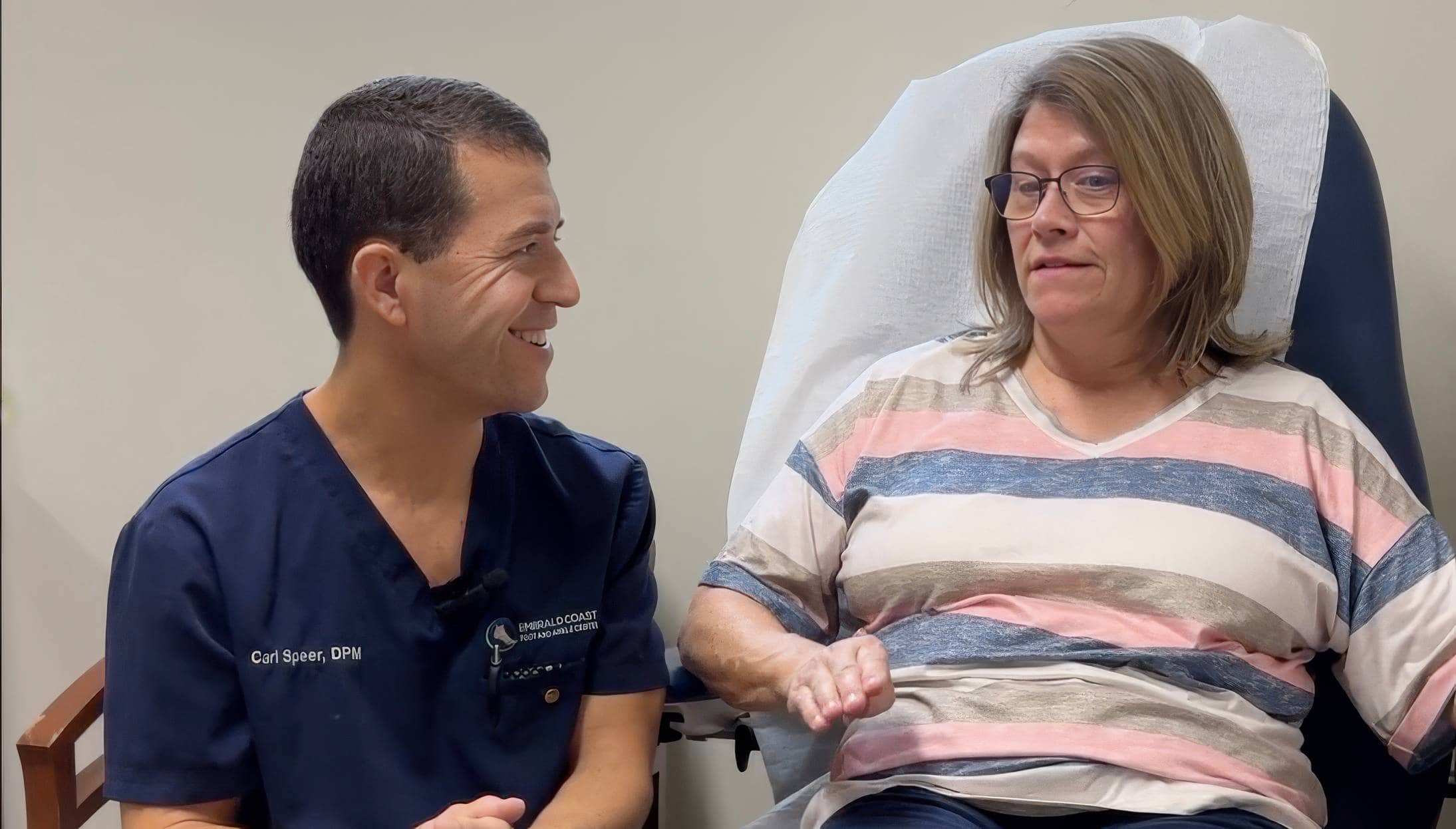 Patient discussing recovery with Dr. Carl Speer, DPM, at Emerald Coast Foot and Ankle Center, showcasing positive post-surgery experience with InvisiFoot™.
